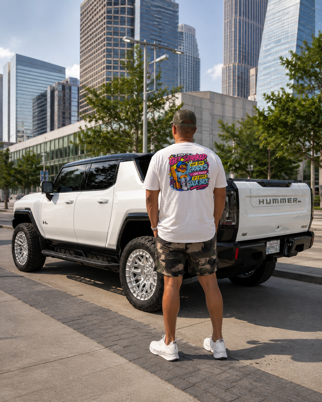 BCS streetwear styled next to a white Hummer EV, showing what to wear at a car meet